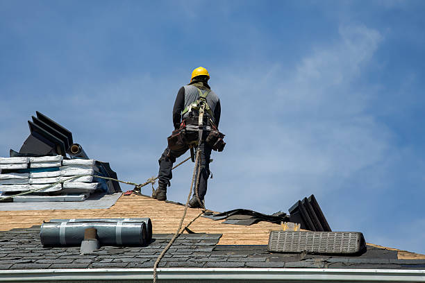 Professional Roofing technician working in Winburne, PA